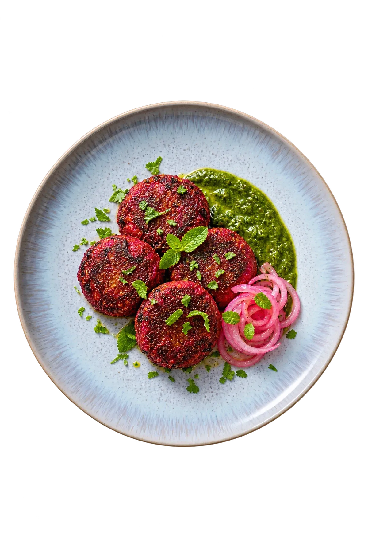 Light Blue Sea dinnerware serving beetroot galouti with mint-coriander chutney and pickled onion.