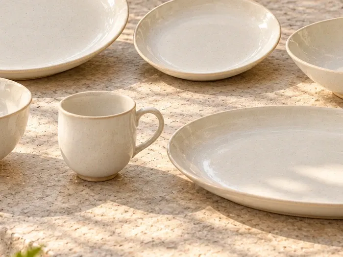 A close detail of Malligai stoneware forms and glaze.