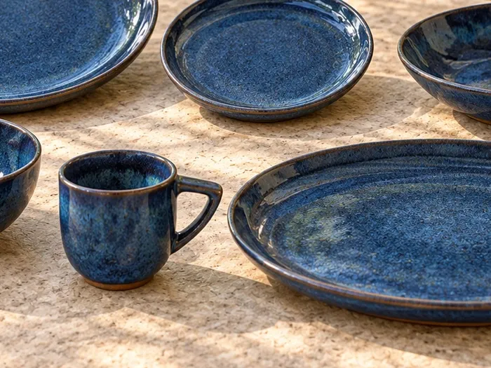 A close detail of Neelam stoneware forms and glaze.
