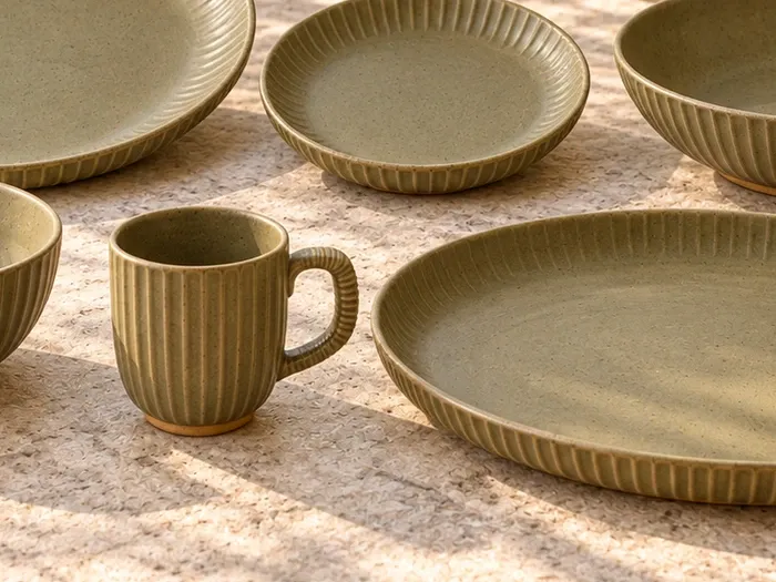A close detail of Vetiver stoneware forms and glaze.